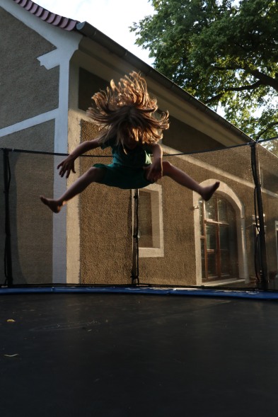 Jumping child with insane hair